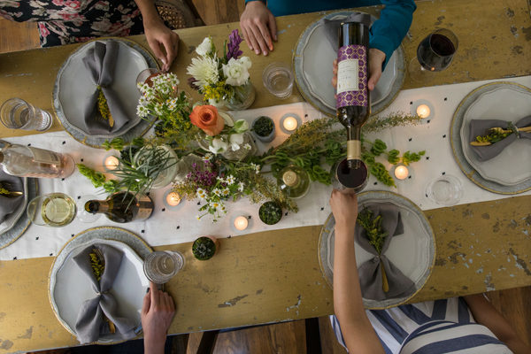 A tablescape incorporating Summer Entertaining Tips from AVA Grace Vineyard