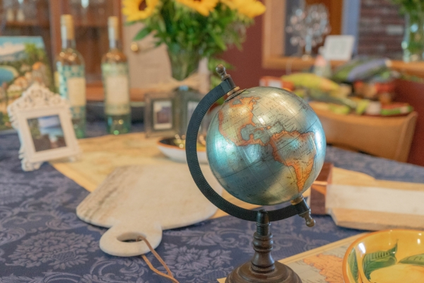 A globe used on a table as a decoration for a welcome home party