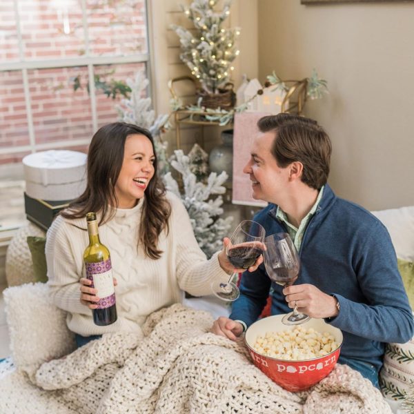 Couple drinking AVA Grace at their holiday gift exchange